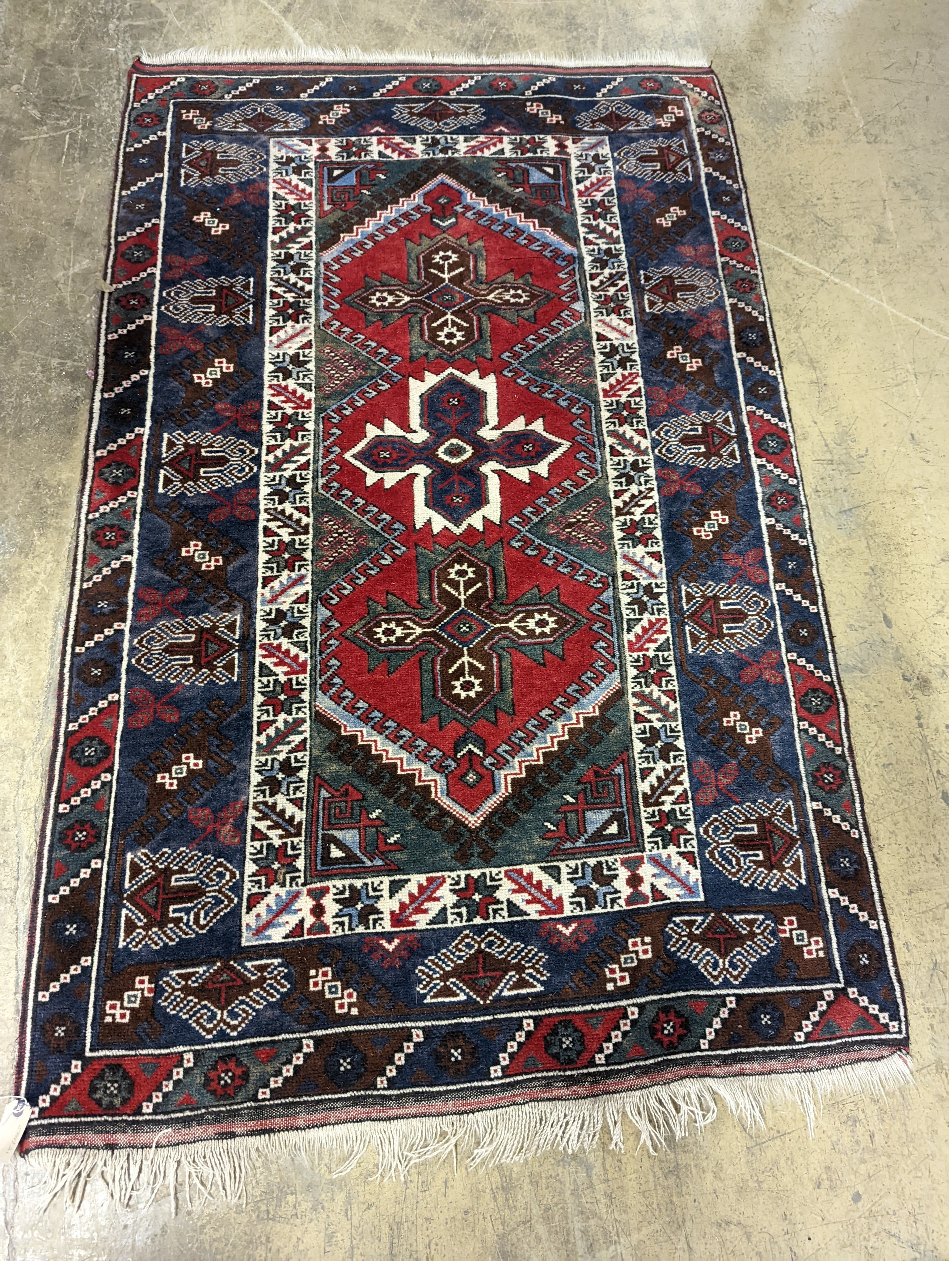 Two Turkish rugs and a Persian rugs. Largest, 284x172cm.